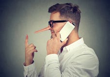 Man telling lies while having phone call royalty free stock images Man telling lies while having phone call royalty free stock images