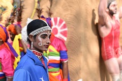 Man in traditional Indian ethnic make up attire, enjoying the fair