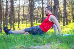 Man trainer showing exercises on the foam roller, the free space. stock photo Man trainer showing exercises on the foam roller, the free space. stock photo