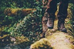 Man Traveler crossing over river on woods outdoor royalty free stock photo Man Traveler crossing over river on woods outdoor royalty free stock photo