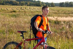 Man traveler cyclist with a bicycle in nature Stock Image Man traveler cyclist with a bicycle in nature Stock Image