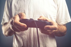 Man using game pad controller to play video games Royalty Free Stock Image Man using game pad controller to play video games Royalty Free Stock Image