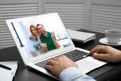 Man using laptop for conversation via video chat at table royalty free stock images Man using laptop for conversation via video chat at table royalty free stock images