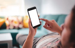 Man using smartphone on sofa stock images Man using smartphone on sofa stock images