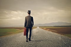 Man walking on a never ending street stock image Man walking on a never ending street stock image