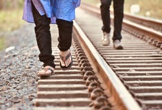 Man walking on the rail tracks isolated unique photograph stock image Man walking on the rail tracks isolated unique photograph stock image