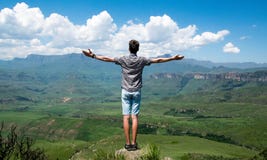 Man Wearing Grey Shirt Standing on Elevated Surface Royalty Free Stock Photography Man Wearing Grey Shirt Standing on Elevated Surface Royalty Free Stock Photography