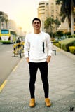 Man in White Crew-neck Sweater Taking Selfie Beside Street Road Royalty Free Stock Photography Man in White Crew-neck Sweater Taking Selfie Beside Street Road Royalty Free Stock Photography
