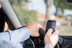 Man With Mobile And Driving Stock Photography