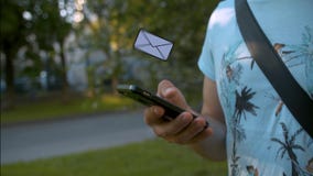 Man With Smartphone Receiving A Letter Royalty Free Stock Photography Man With Smartphone Receiving A Letter Royalty Free Stock Photography