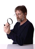 Man With The Magnifying Glass In Hand Stock Photography