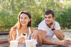 https://thumbs.dreamstime.com/t/man-woman-young-couple-drinking-coffee-city-park-women-sitting-summer-66037186.jpg