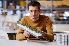 Man working with maquette in design and engineering architecture Stock Images Man working with maquette in design and engineering architecture Stock Images