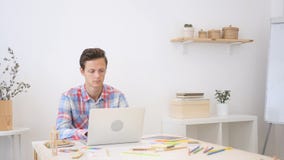 Man working on his laptop in creative office, Busy on New Project stock photos Man working on his laptop in creative office, Busy on New Project stock photos