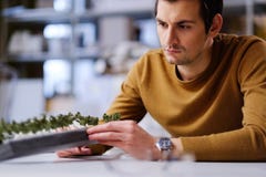 Man working with maquette in design and engineering architecture Stock Images Man working with maquette in design and engineering architecture Stock Images