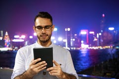 Man works tablet computer night big city royalty free stock photo Man works tablet computer night big city royalty free stock photo