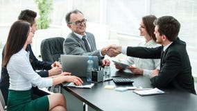 Manager and client shaking hands after discussing the contract stock photography Manager and client shaking hands after discussing the contract stock photography