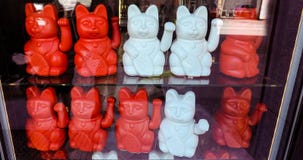 Maneki neko also known as chinese fortune cat stock photos Maneki neko also known as chinese fortune cat stock photos