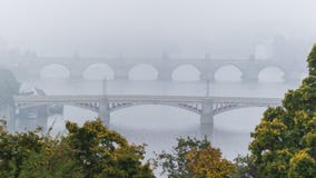 Manes and Charles bridge over Moldau river in mist royalty free stock photography Manes and Charles bridge over Moldau river in mist royalty free stock photography
