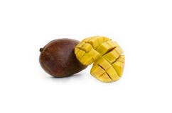 Mango cubes and mango fruit Isolated on a white background stock photo Mango cubes and mango fruit Isolated on a white background stock photo
