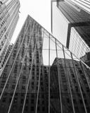 New York, USA - February 2018: Reflection of building on the glass facade in New York stock photography New York, USA - February 2018: Reflection of building on the glass facade in New York stock photography