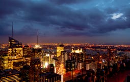 Sundown from the top of the rock - Times Square Illuminations to the bottom left of the frame of the frame in colour stock images Sundown from the top of the rock - Times Square Illuminations to the bottom left of the frame of the frame in colour stock images