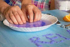 Manicure at home. Woman dipping her hand in a bowl of water. Nail Care. stock images Manicure at home. Woman dipping her hand in a bowl of water. Nail Care. stock images