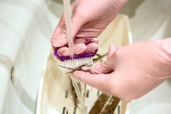 Manicure tool washing under running water after soaking in chemical solutions. the concept of sterilization and disinfection royalty free stock photo Manicure tool washing under running water after soaking in chemical solutions. the concept of sterilization and disinfection royalty free stock photo