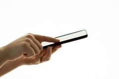 Mano femenina que sostiene el teléfono móvil imagen de archivo Mano femenina que sostiene el teléfono móvil imagen de archivo