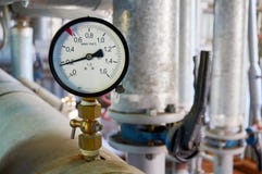 Manometer on the hot water pipeline in the boiler room. royalty free stock photos Manometer on the hot water pipeline in the boiler room. royalty free stock photos