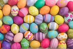 Many Bright and Colorful Easter Eggs Filling the Background. They are hand-painted or dyed.