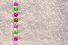 Colorful glass christmas balls on the shining snow background. royalty free stock photos Colorful glass christmas balls on the shining snow background. royalty free stock photos