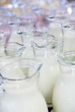 Many glass jugs with milk and yogurt stock photo Many glass jugs with milk and yogurt stock photo