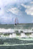 Many Surfers Windsurfing In A Storm Stock Images