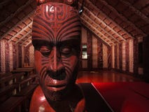 New Zealand: native Maori meeting house. Maori meeting house marae with carved wooden head post royalty free stock photo New Zealand: native Maori meeting house. Maori meeting house marae with carved wooden head post royalty free stock photo