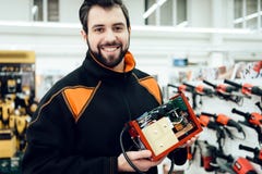 Map is posing with uninterruptible power supply, ups model in power tools store. stock photo Map is posing with uninterruptible power supply, ups model in power tools store. stock photo