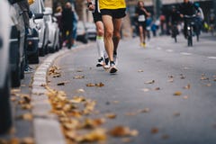 Marathon Running Race, People Feet On Autumn Road. Runners Run UMarathon Running Race, People Feet On Autumn Road. Runners Run Urb Stock Image Marathon Running Race, People Feet On Autumn Road. Runners Run UMarathon Running Race, People Feet On Autumn Road. Runners Run Urb Stock Image