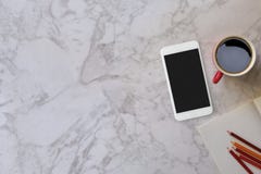 Marble desk table with a red mug and color pencil royalty free stock images Marble desk table with a red mug and color pencil royalty free stock images