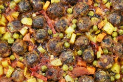 On marble floor, meatballs with vegetables, in glass baking dish royalty free stock photo On marble floor, meatballs with vegetables, in glass baking dish royalty free stock photo