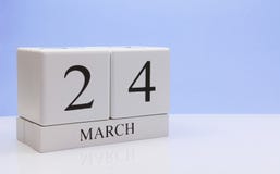 March 24st. Day 24 of month, daily calendar on white table with reflection, with light blue background. Spring time, empty space royalty free stock photos March 24st. Day 24 of month, daily calendar on white table with reflection, with light blue background. Spring time, empty space royalty free stock photos