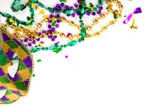A Mardi gras mask and beads on a white background with copy space royalty free stock image A Mardi gras mask and beads on a white background with copy space royalty free stock image