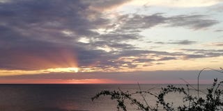 Marine contrasting sunset landscape. The rays of the setting sun pierce the clouds. Background royalty free stock photos Marine contrasting sunset landscape. The rays of the setting sun pierce the clouds. Background royalty free stock photos