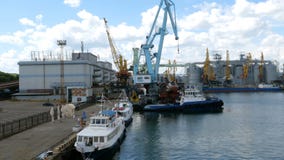 Marine port cranes, and industrial zone in cargo front of Odessa sea commercial port in Ukraine. stock video Marine port cranes, and industrial zone in cargo front of Odessa sea commercial port in Ukraine. stock video