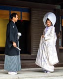 married couple looks at each other with love before a traditional Japan wedding