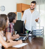 Married couple signing contract in the office Royalty Free Stock Photos Married couple signing contract in the office Royalty Free Stock Photos