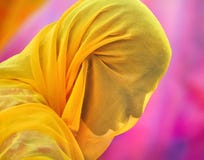 Married woman from Pushkar wearing orange scarf on violet background Royalty Free Stock Image Married woman from Pushkar wearing orange scarf on violet background Royalty Free Stock Image