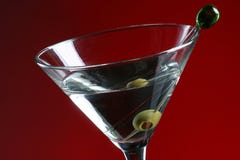 Martini and Olive. Detail of Martini glass and olive in toothpic Martini and Olive. Detail of Martini glass and olive in toothpic