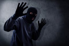 Masked burglar caught by police royalty free stock photography Masked burglar caught by police royalty free stock photography