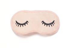 Masque rose en pastel de sommeil avec les yeux ferm?s brod? l?-dessus avec des cils sur le fond blanc Vue sup?rieure, configurati photo libre de droits Masque rose en pastel de sommeil avec les yeux ferm?s brod? l?-dessus avec des cils sur le fond blanc Vue sup?rieure, configurati photo libre de droits