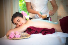Masseur doing massage spa with treatment sugar scrub on Asian woman body in the Thai spa lifestyle, so relax and luxury. stock photography Masseur doing massage spa with treatment sugar scrub on Asian woman body in the Thai spa lifestyle, so relax and luxury. stock photography
